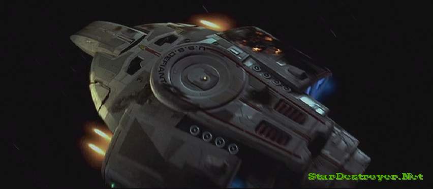 The USS Defiant opens fire with its pulse phasers