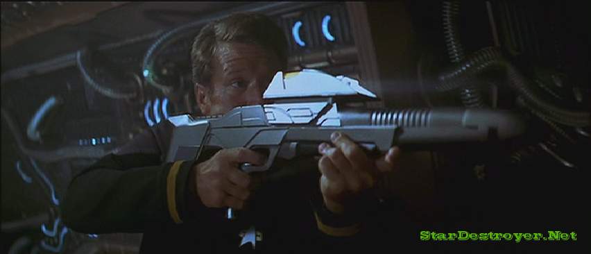 A Starfleet crewman firing a pulse phaser rifle