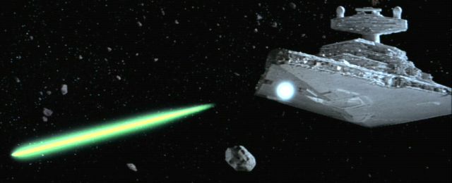 An asteroid explodes harmlessly against the powerful bow shields of an Imperial Star Destroyer