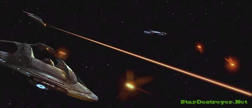 Federation ships fire torpedoes and phasers at a Borg warship (offscreen)